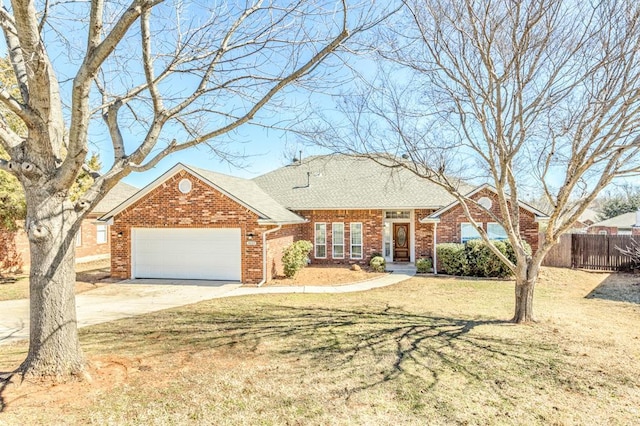 view of front of property featuring a garage, brick siding, fence, concrete driveway, and a front yard