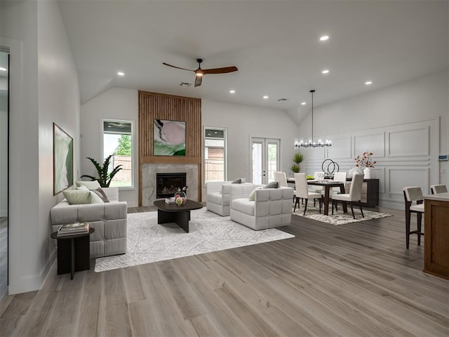 6409 NW 153rd St, Edmond, OK 73013 - living room with recessed lighting, vaulted ceiling, a wealth of natural light, and a high end fireplace