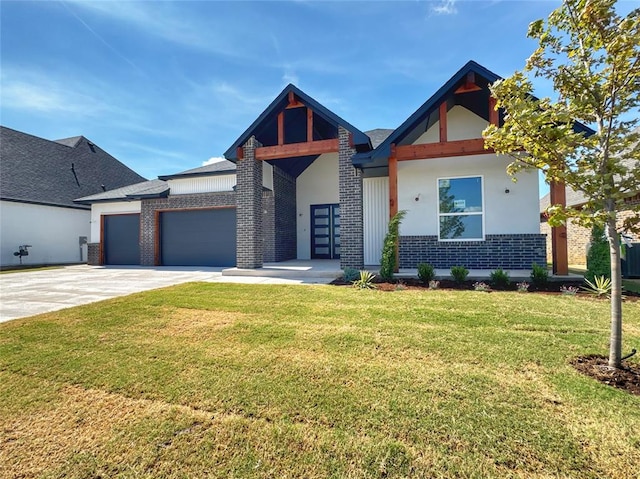6409 NW 153rd St, Edmond, OK 73013 - view of front of house featuring an attached garage, concrete driveway, a front lawn, brick siding, and stucco siding