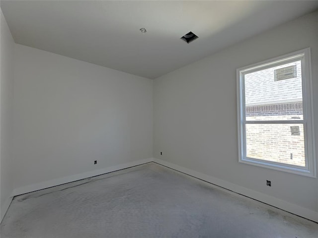 6409 NW 153rd St, Edmond, OK 73013 - spare room with concrete floors