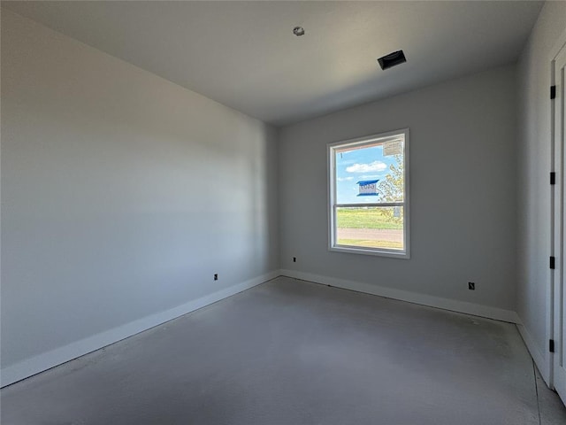 6409 NW 153rd St, Edmond, OK 73013 - empty room featuring concrete floors and baseboards