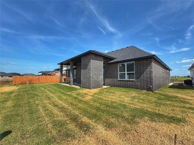 6409 NW 153rd St, Edmond, OK 73013 - back of house featuring brick siding