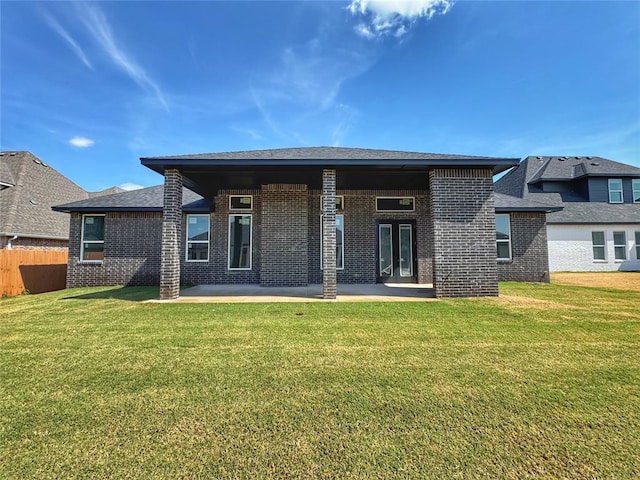 6409 NW 153rd St, Edmond, OK 73013 - back of house featuring brick siding and a patio