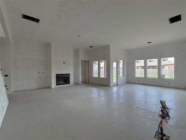 6309 NW 154th Ter, Edmond, OK 73013 - unfurnished living room featuring a fireplace