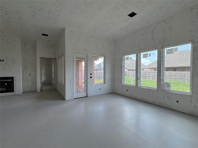 6309 NW 154th Ter, Edmond, OK 73013 - unfurnished living room with a fireplace