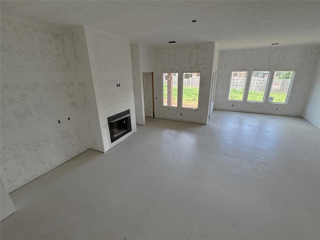 6309 NW 154th Ter, Edmond, OK 73013 - unfurnished living room featuring a fireplace
