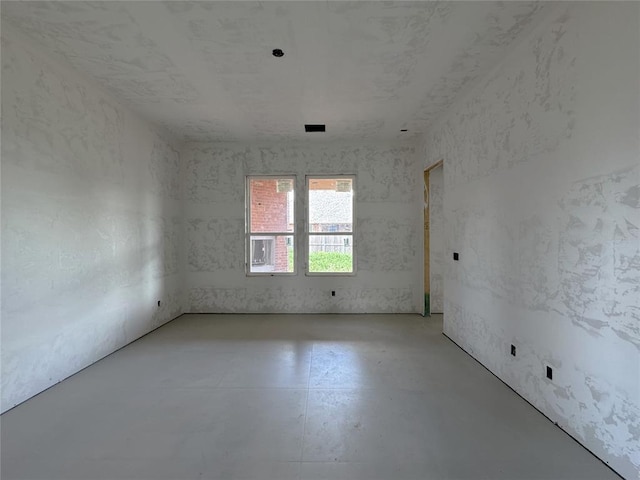 6309 NW 154th Ter, Edmond, OK 73013 - spare room with concrete flooring