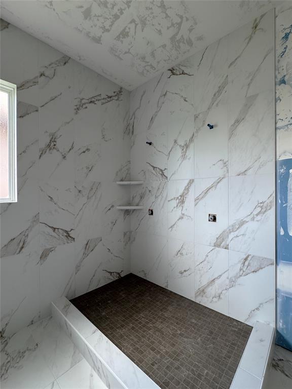 6309 NW 154th Ter, Edmond, OK 73013 - full bathroom featuring marble finish flooring and a marble finish shower