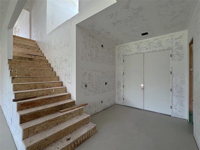 6309 NW 154th Ter, Edmond, OK 73013 - staircase featuring concrete floors