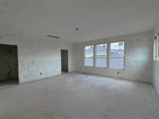 6309 NW 154th Ter, Edmond, OK 73013 - spare room with unfinished concrete floors