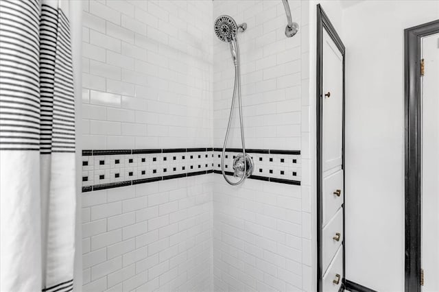 full bath featuring a tile shower