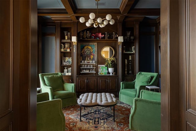 living area with built in features, beam ceiling, crown molding, visible vents, and coffered ceiling