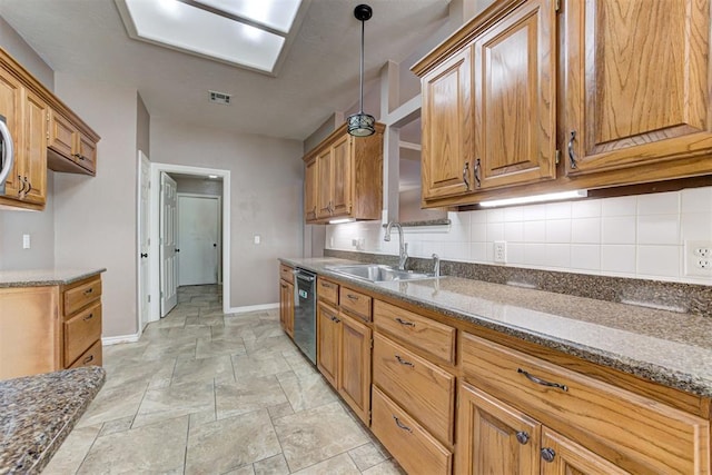 kitchen with a sink, visible vents, baseboards, brown cabinets, and dishwasher