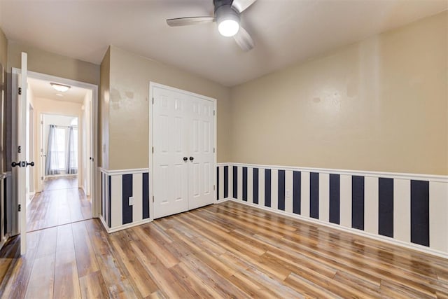 empty room featuring ceiling fan and wood finished floors