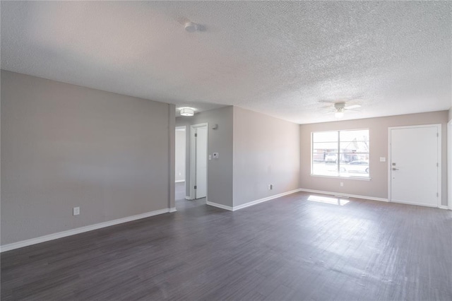 unfurnished living room with baseboards, a textured ceiling, ceiling fan, and dark wood-style floors
