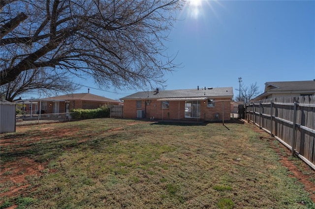 view of yard with a fenced backyard