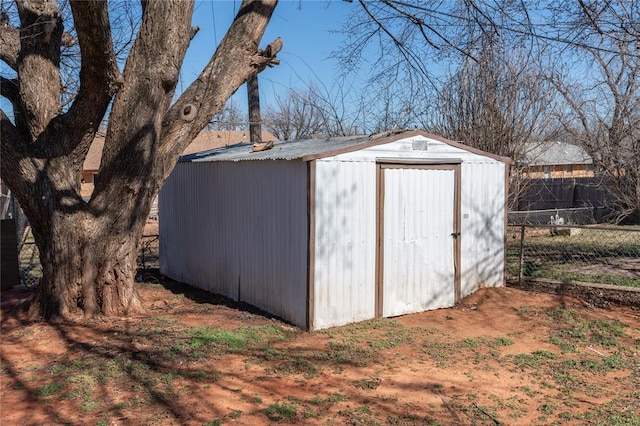 view of shed with fence
