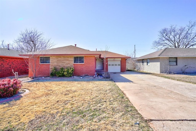 single story home featuring a garage, concrete driveway, and brick siding