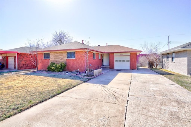 ranch-style house featuring a front yard, brick siding, driveway, and an attached garage