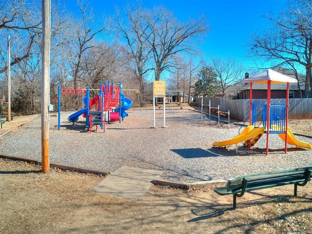 communal playground featuring fence