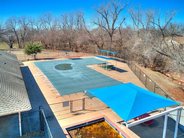 view of pool featuring fence