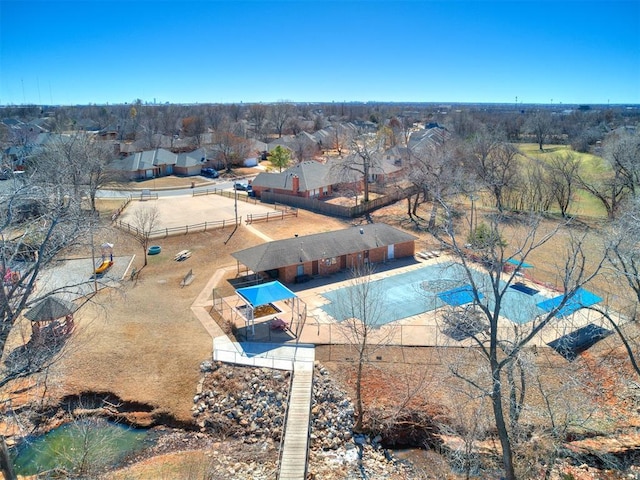 view of swimming pool with fence