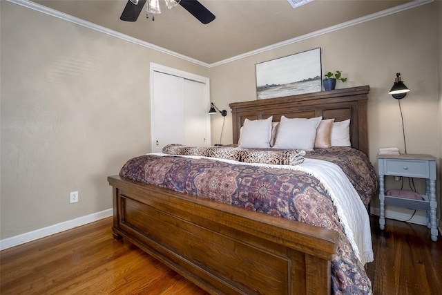 bedroom featuring a ceiling fan, baseboards, ornamental molding, and wood finished floors