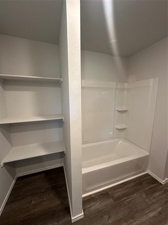 43068 Wagon Trl, Shawnee, OK 74804 - bathroom with wood finished floors and shower / bathtub combination