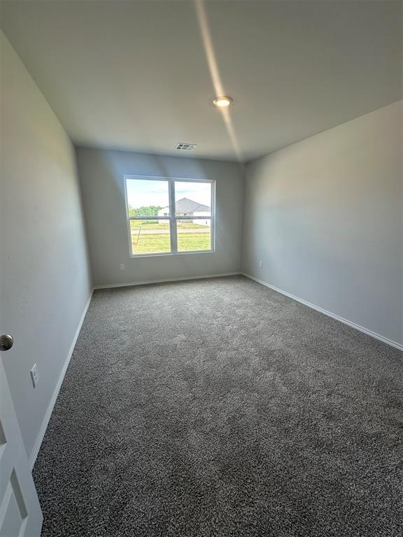 43068 Wagon Trl, Shawnee, OK 74804 - empty room featuring carpet floors and baseboards