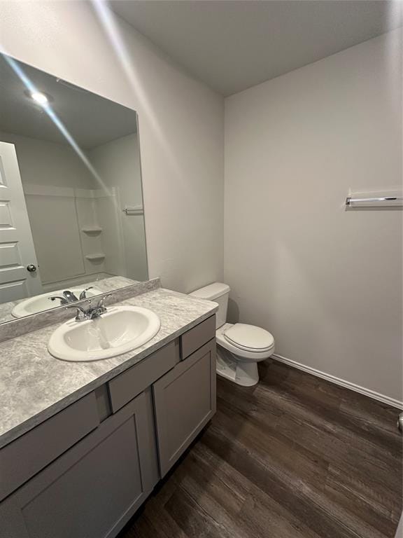 43068 Wagon Trl, Shawnee, OK 74804 - bathroom with wood finished floors, a shower, and vanity
