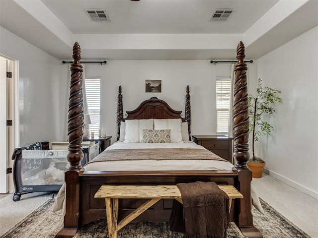 carpeted bedroom with baseboards and visible vents