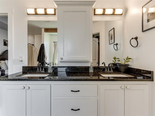 bathroom with double vanity and a sink