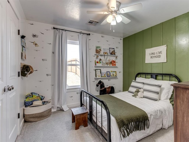 bedroom featuring ceiling fan, carpet, and visible vents