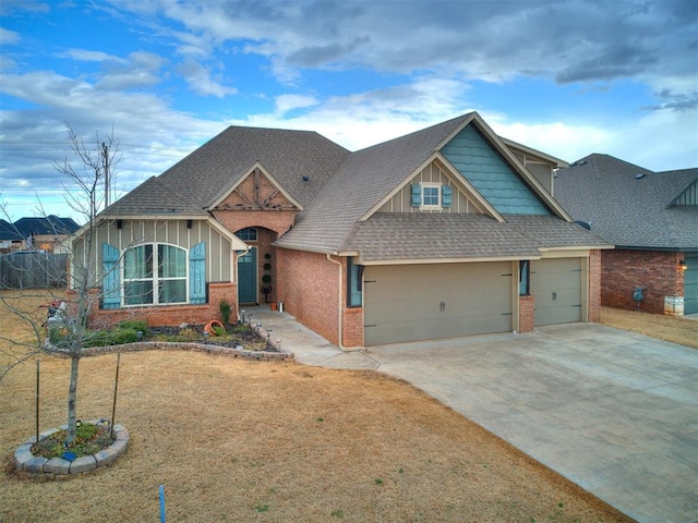 view of front of home with brick siding, a shingled roof, concrete driveway, an attached garage, and board and batten siding