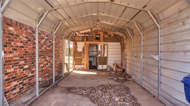 miscellaneous room with lofted ceiling and a garage