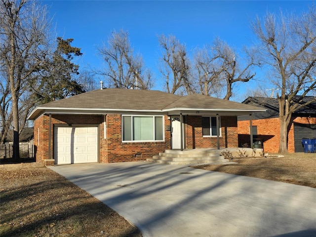 single story home with driveway, brick siding, an attached garage, and fence