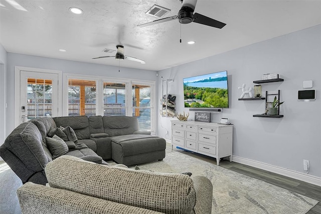 living room featuring recessed lighting, visible vents, ceiling fan, wood finished floors, and baseboards