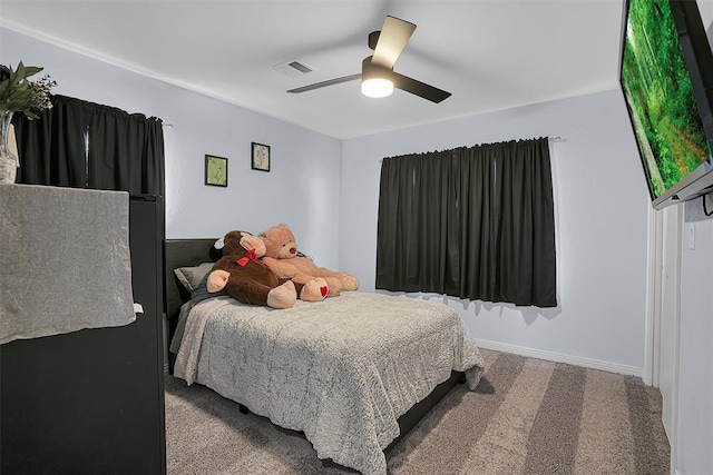 bedroom featuring baseboards, ceiling fan, visible vents, and carpet flooring