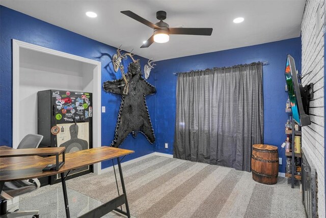 carpeted office space with a ceiling fan, recessed lighting, and baseboards