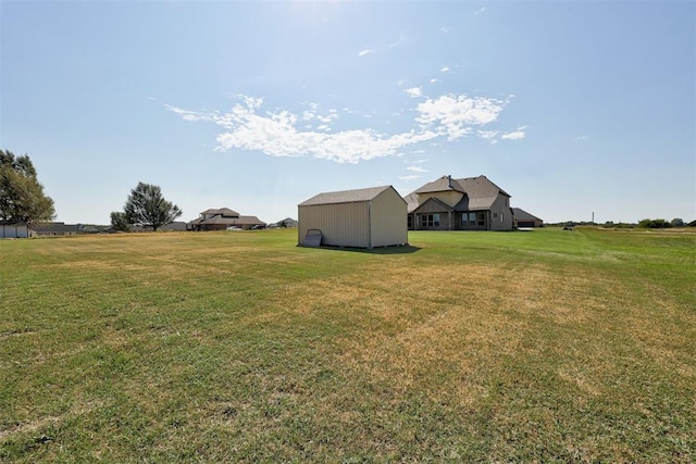 view of yard with a shed and an outdoor structure