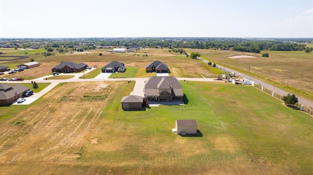 birds eye view of property featuring a rural view