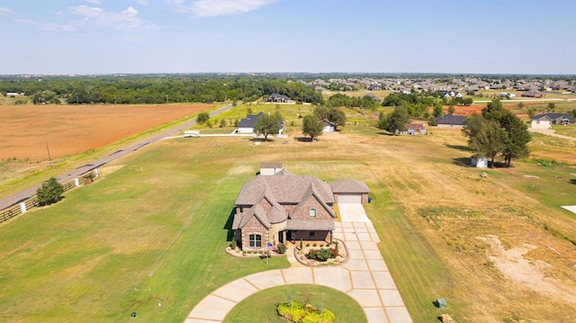 birds eye view of property featuring a rural view