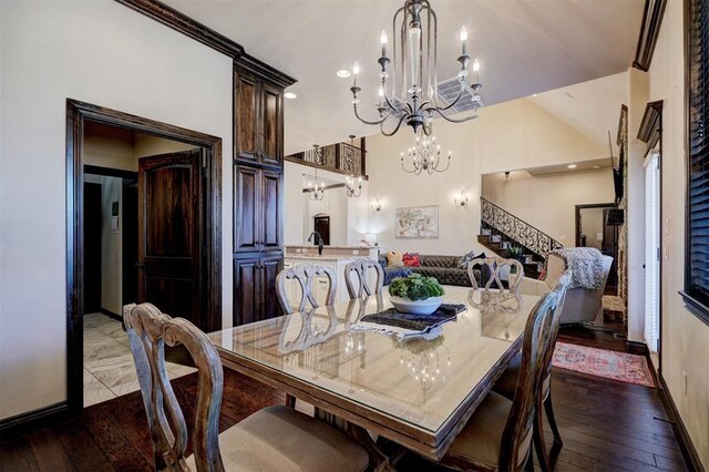 dining space with baseboards, a chandelier, stairs, and hardwood / wood-style flooring