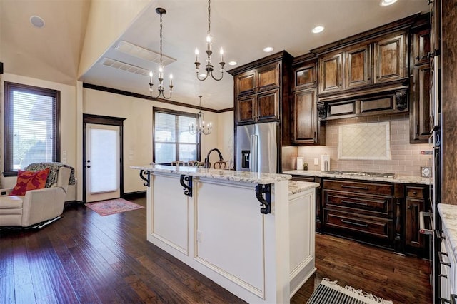 kitchen with visible vents, tasteful backsplash, appliances with stainless steel finishes, and dark wood-style flooring