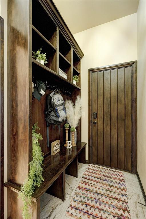 mudroom featuring marble finish floor