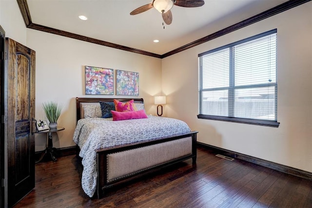 bedroom with baseboards, visible vents, ceiling fan, hardwood / wood-style flooring, and crown molding