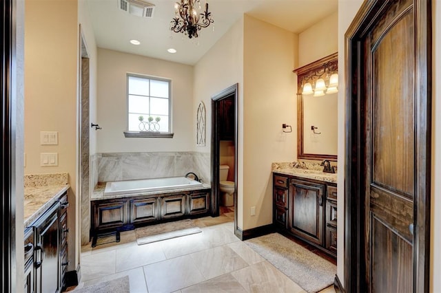 bathroom featuring visible vents, toilet, a notable chandelier, a bath, and vanity