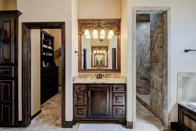 full bath with vanity, a tub, a tile shower, and a chandelier