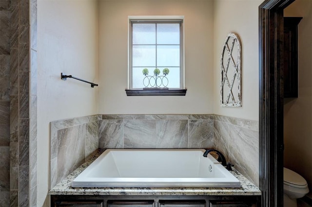 bathroom with a bath and toilet