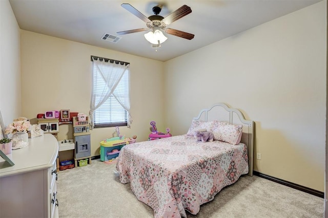 carpeted bedroom with a ceiling fan, baseboards, and visible vents